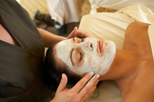 esthetician and client during facial esthetician and client during facial